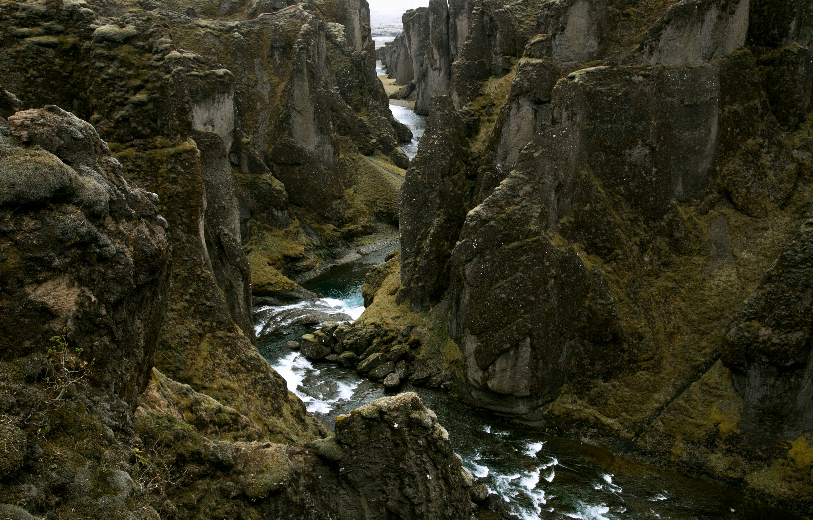 rocky terrain with river in middle